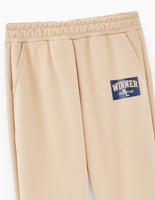 Бежевые брюки-джоггеры для мальчика