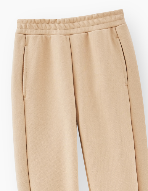 Бежевые брюки-джоггеры для мальчика