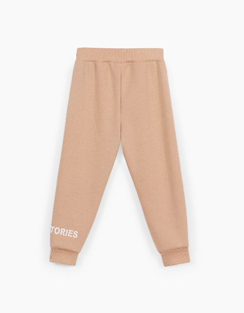 Бежевые брюки-джоггеры для девочки